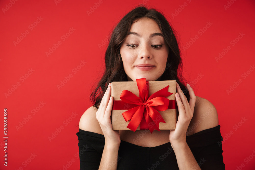 Fototapeta premium Happy young woman wearing a dress standing
