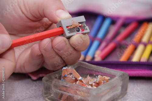 Woman sharpening wooden crayons