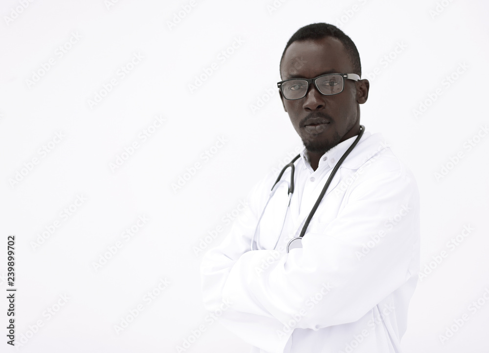 portrait of a responsible young doctor on a light background.