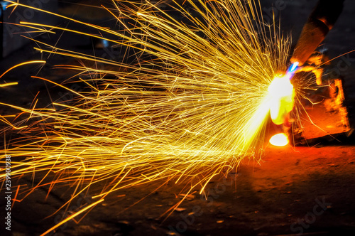 Arc welding of a steel, tool and sparks