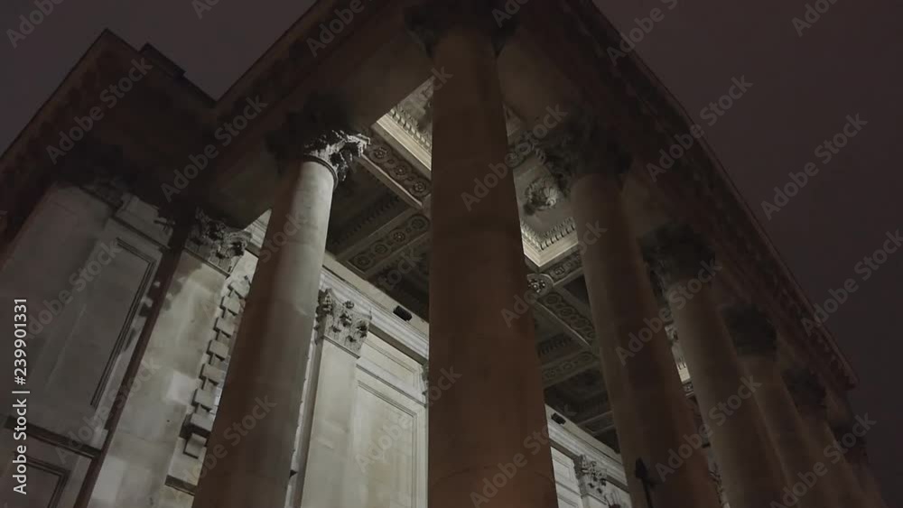 Low angle view of old stone columns at night. Low angle view of old stone columns at night.