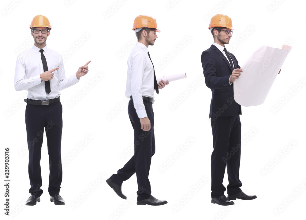 in full growth .a qualified architect in an orange helmet in full growth .a qualified architect in an orange helmet