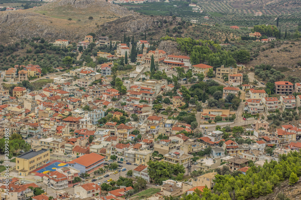 aerial photography of medieval small city in south Europe on Peloponnese area in Greece  surrounded by mountain