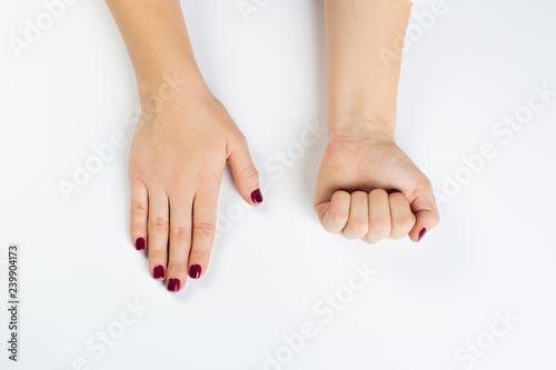 Top view photo of woman's hands with dark manicure