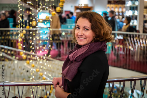 Woman doing Christmas shopping in luxury arcade, London photo