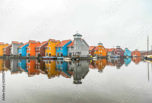 Multicolored houses on lake