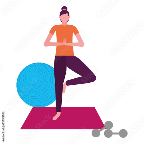woman making yoga with mat and dumbbells