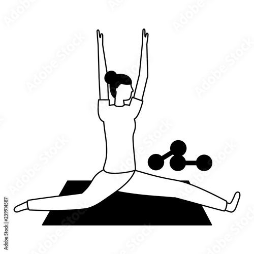 woman making yoga with mat and dumbbells