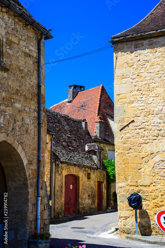 Street scene and architecture from the medivial bastide village of Domme in the Dordogne region of France