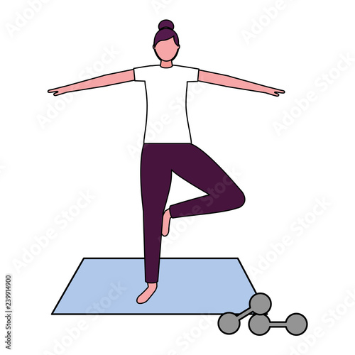 woman making yoga with mat and dumbbells