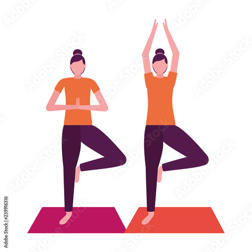 women practicing yoga on mat