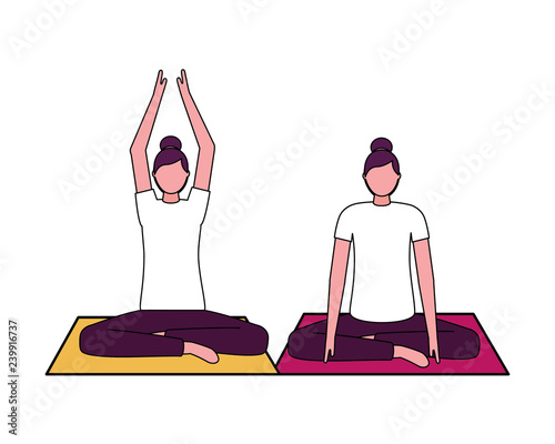 women practicing yoga on mat