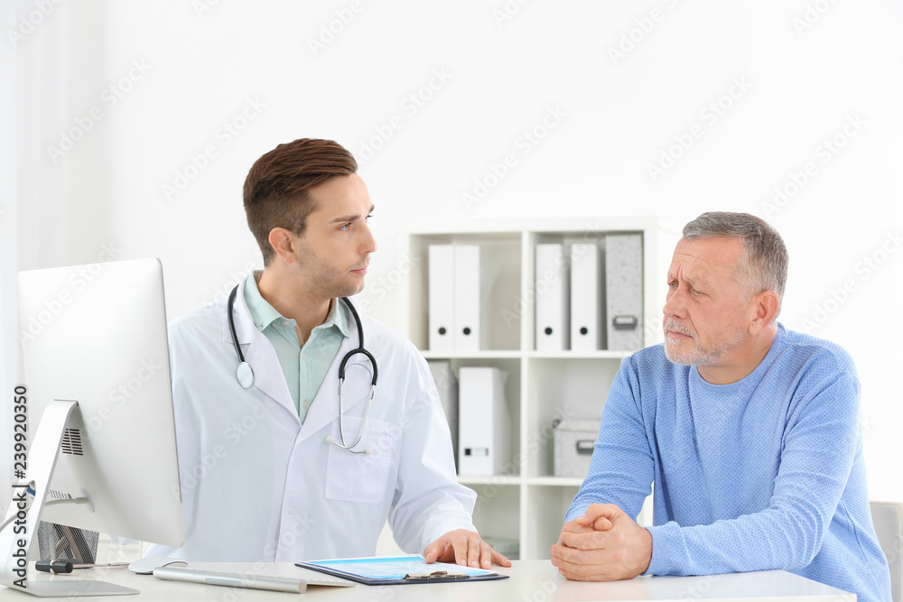 Doctor working with mature patient in hospital Doctor working with mature patient in hospital