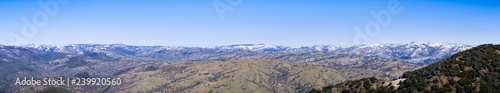 Panoramic view of the Ohlone Wilderness, part of the mountains in the Diablo Range, covered in a thin layer of snow on a winter morning; as seen from Mt Hamilton, San Jose, San Francisco bay area