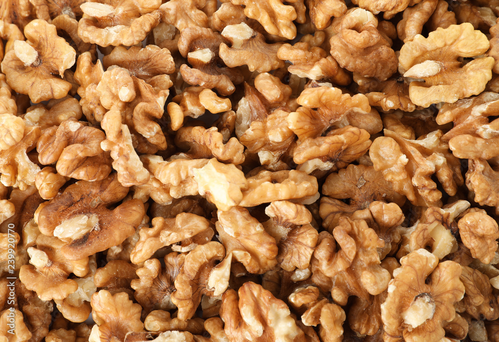 Many shelled walnuts as background, top view Many shelled walnuts as background, top view