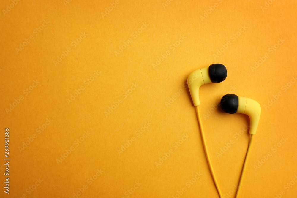 Stylish headphones on color background, top view. Space for text
