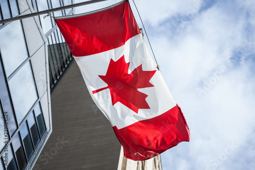 Photography Canadian flag in front of a business building in Toronto, Ontario, Canada