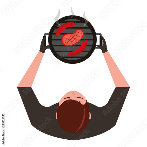 man holdingbarbecue grill with sausages and meat