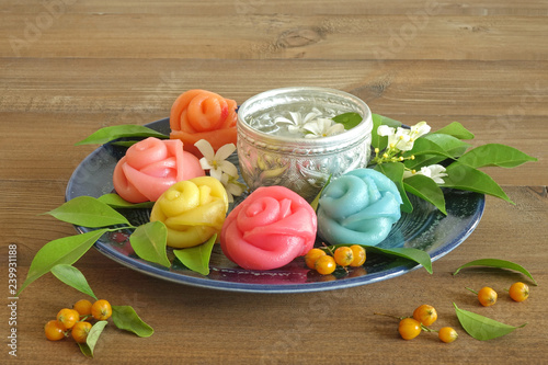 Thai dessert : Layer sweet cake (Khanom Chan) Thai traditional dessert in colorful roses shape , Thai food / Thai dessert, Sweet and delicioud .Space for texts photo