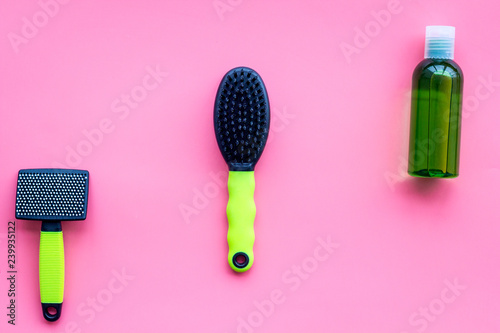 care about pet with brushes and grooming equipment pink background top view mockup