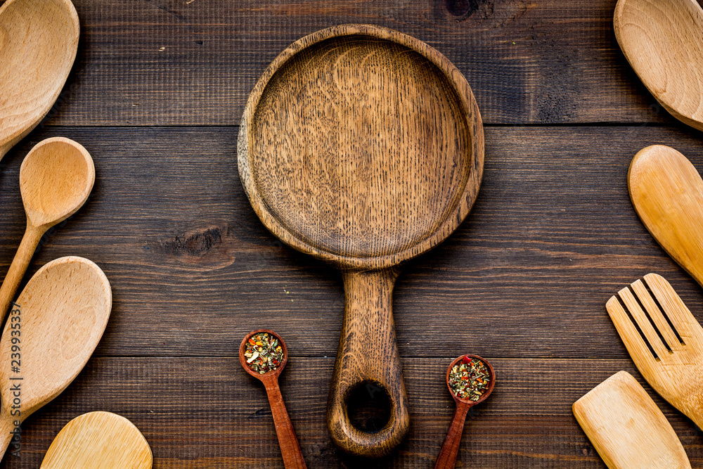 Village table with wooden cutlery set rustic background top view