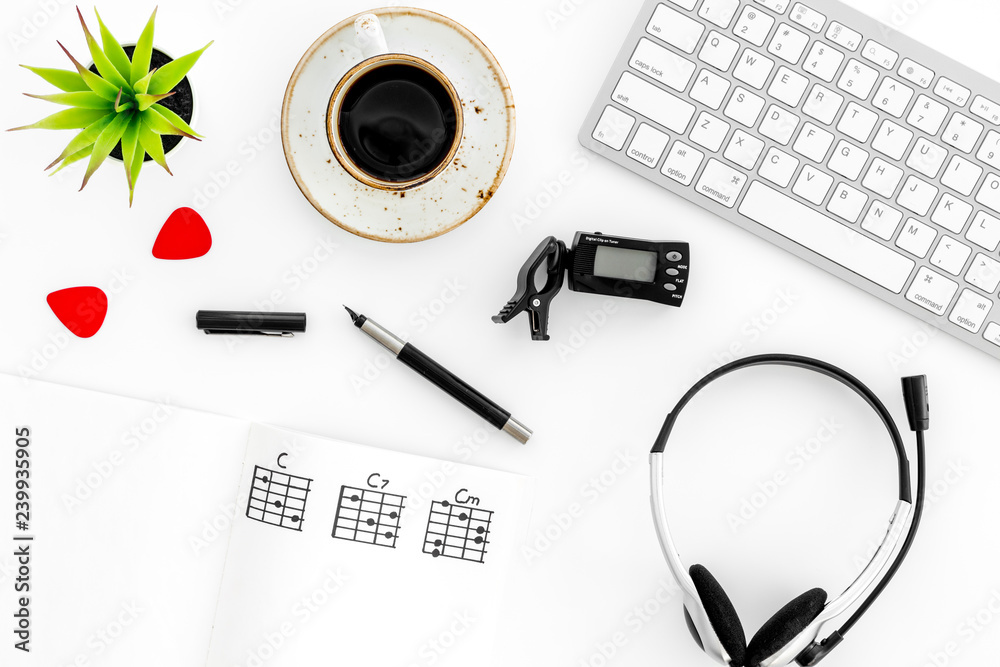 Desk of musician for songwriter work with hearts, coffee, keyboard, headphones and notes marble background top view - obrazy, fototapety, plakaty 