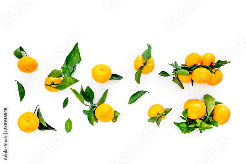 New Year and Christmas Eve with mandarins. Citrus winter fruits on white background top view