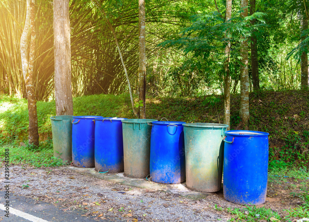 Plastic trash can are blue and green in a rows Plastic trash can are blue and green in a rows