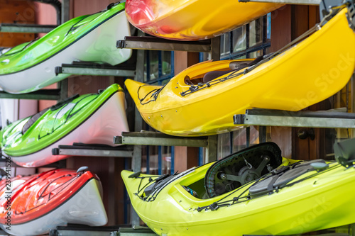 Fotografija Brightly colored kayaks for rental stacked outside a water sports shop in Vancou