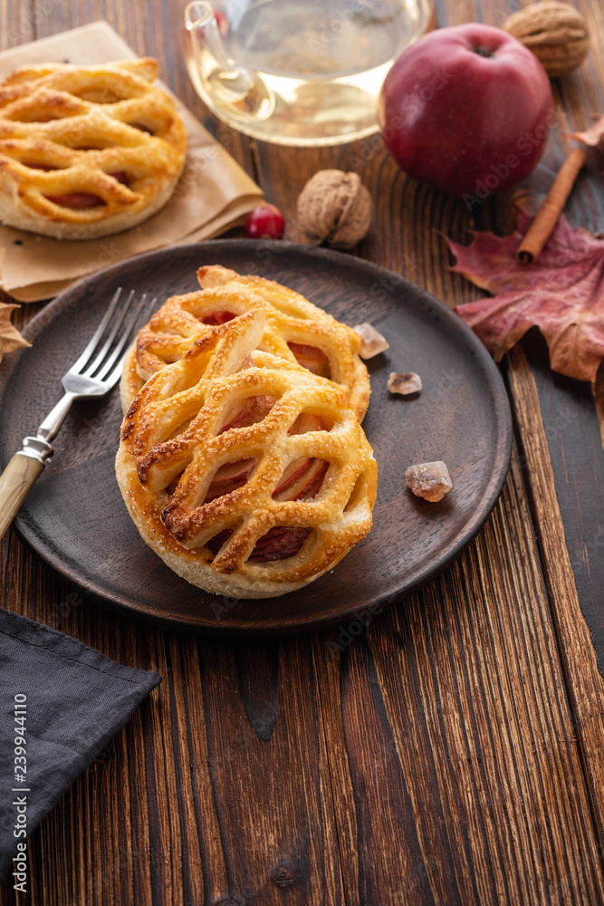 Homemade Apple pie or tart on autumn background. Autumn concept. Copy space. Homemade Apple pie or tart on autumn background. Autumn concept. Copy space.