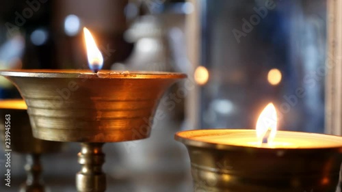 Candles burn in the Gandantegchinlen Temple in Ulaanbaatar, Mongolia photo