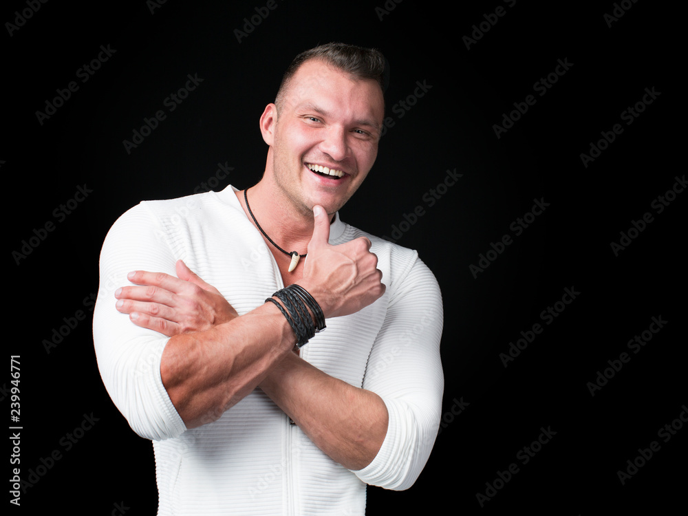 Portrait of handsome smiley man over dark background Portrait of handsome smiley man over dark background