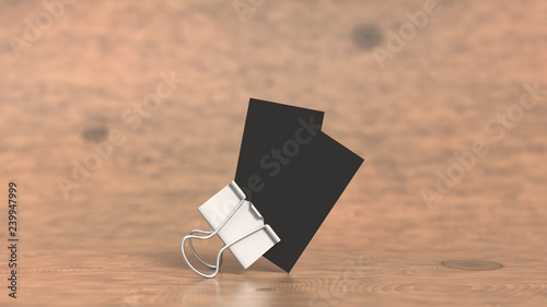 Two black business cards in paper clip