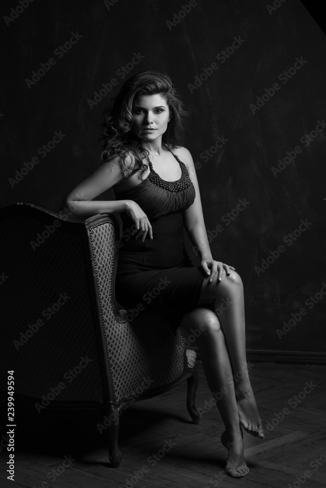 Happy and elegant woman portrait studio shot black and white. Attractive adult brunette sexy girl on black background. Long beautiful healthy hair model girl stock image. Happy and elegant woman portrait studio shot black and white. Attractive adult brunette sexy girl on black background. Long beautiful healthy hair model girl stock image.