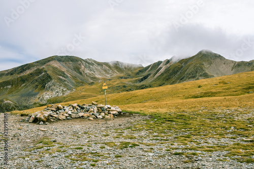 Hiking in the mountains on a cloudy day. photo