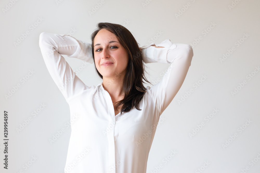 Dreamy office employee leaning nap on hands and smiling at camera. Relaxed young woman planning vacation. Dreaming concept Dreamy office employee leaning nap on hands and smiling at camera. Relaxed young woman planning vacation. Dreaming concept