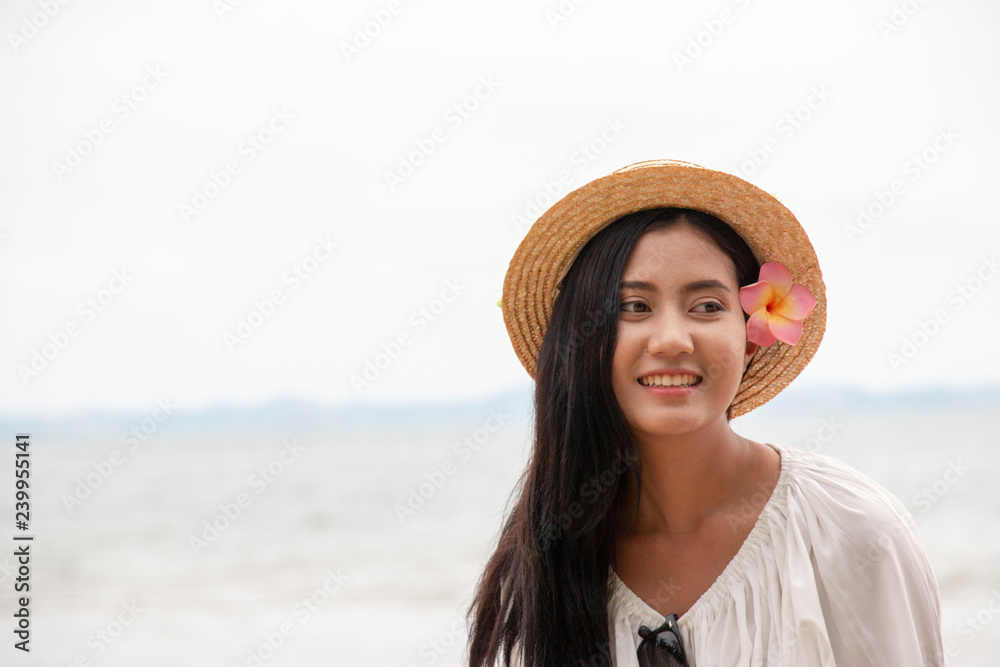 Beautiful Thai woman is at the beach