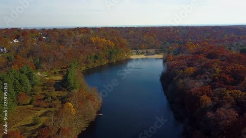 Aerial, beautiful changing colors along Lake Mohegan beachfront, New England photo