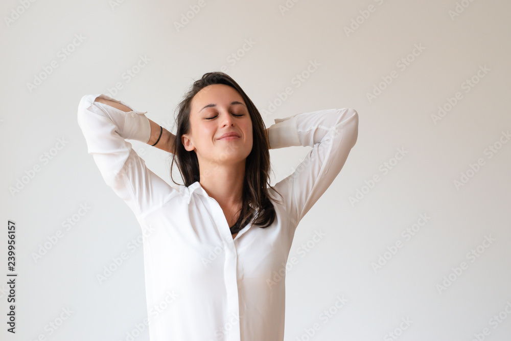 Relaxed office worker thinking over vacation. Dreamy young woman with closed eyes leaning nap on hands. Dreaming concept Relaxed office worker thinking over vacation. Dreamy young woman with closed eyes leaning nap on hands. Dreaming concept