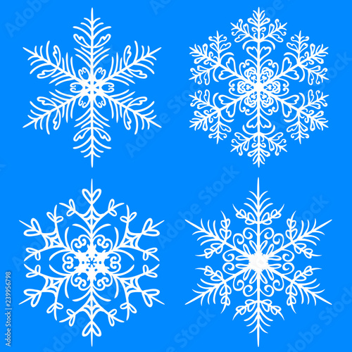 Snowflake winter set. Vector silhouettes on blue background