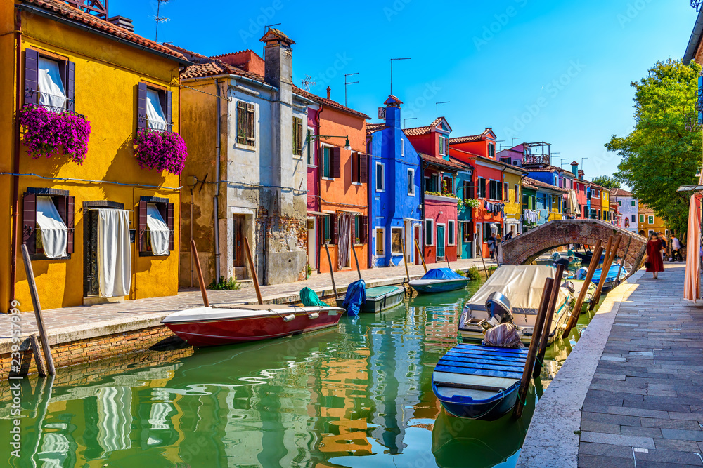 Obraz premium Street with colorful buildings in Burano island, Venice, Italy. Architecture and landmarks of Venice, Venice postcard