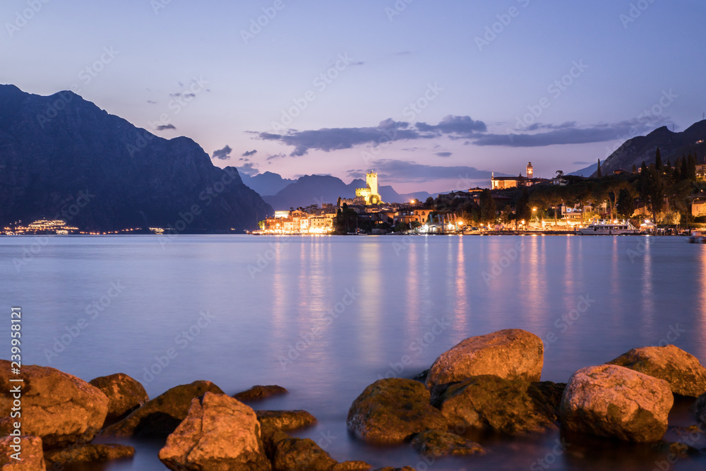 Evening scene at lago di garda: Lake, rocks and village