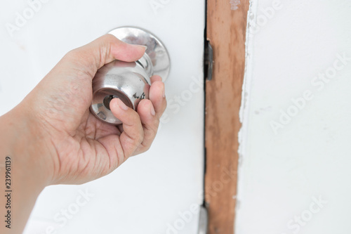 Hand holding a door knob