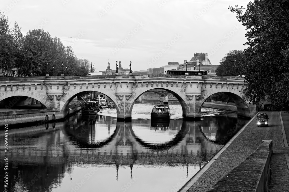 barge under the Pont Neuf bridge in Paris