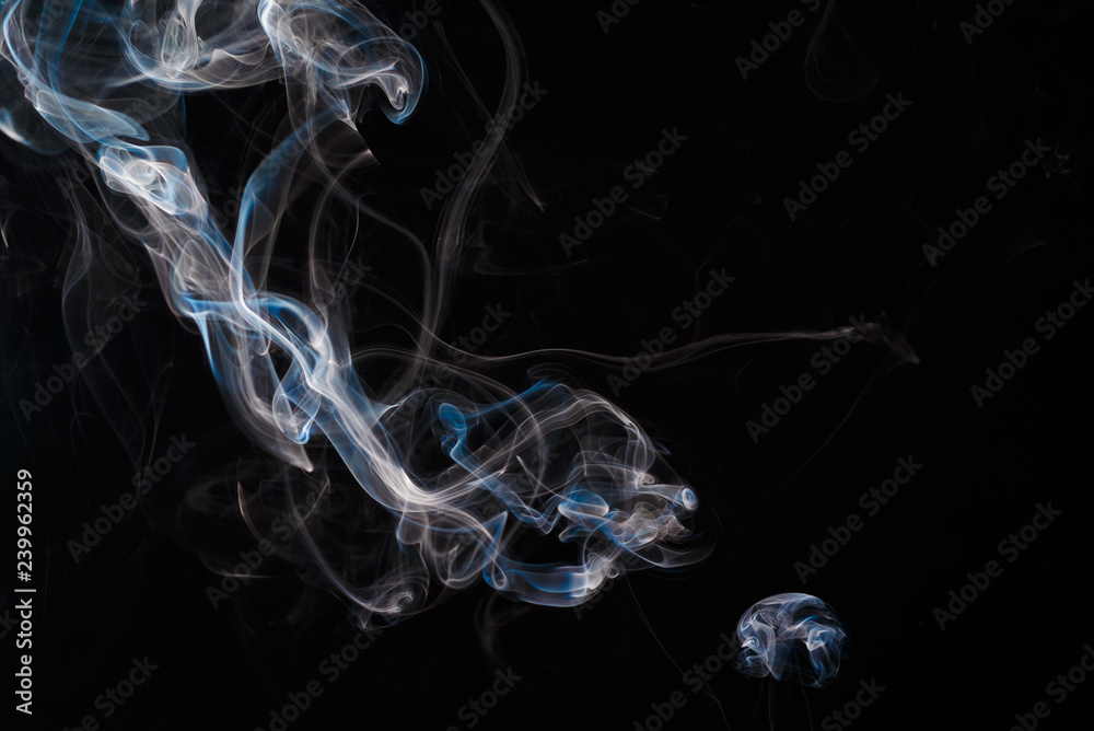 Smoke fragments on a black background Smoke fragments on a black background