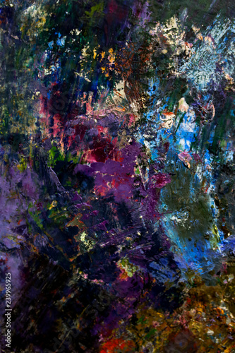 multi-colored strokes of oil paint on the artist's palette. background