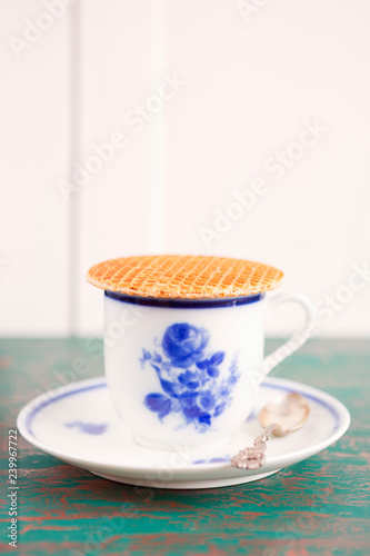 Cup of coffee with a Dutch stroopwafel cookie © sara_winter