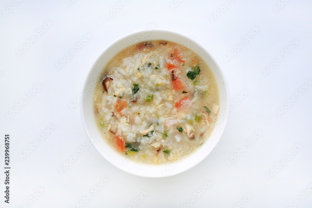 Porridge for baby food in white ceramic bowl on white background. Porridge for baby food in white ceramic bowl on white background.
