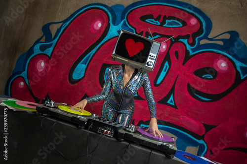 tv head woman and graffiti wall dj