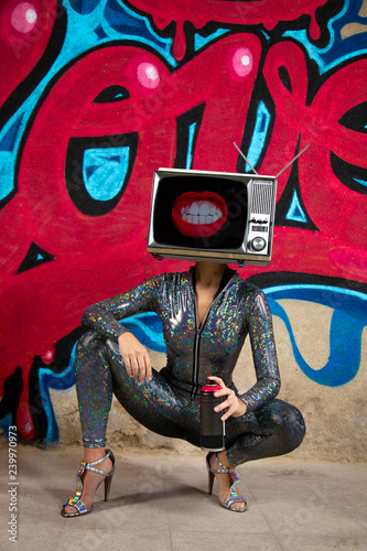 tv head woman and graffiti wall